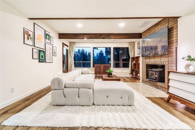 830 S 301st Pl, Federal Way, WA 98003 - living area with beamed ceiling, a wood stove, wood finished floors, and recessed lighting