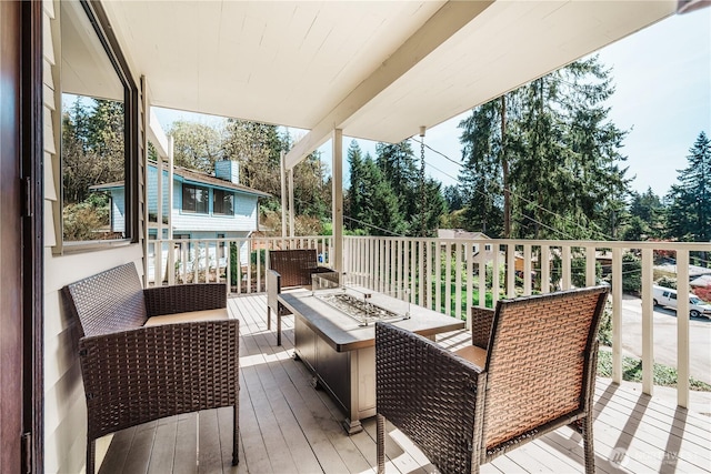 830 S 301st Pl, Federal Way, WA 98003 - wooden terrace with an outdoor living space with a fire pit and view of scattered trees