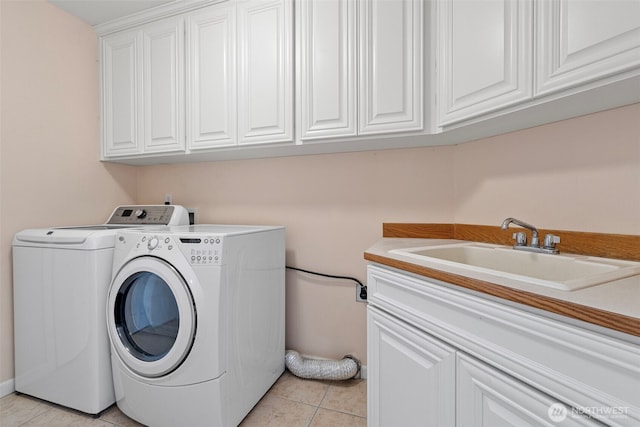 22019 84th Avenue Ct E, Graham, WA 98338 - washroom featuring cabinet space, separate washer and dryer, and light tile patterned floors