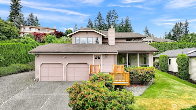 1708 Whatcom St, Bellingham, WA 98229 - view of front of house featuring a chimney, driveway, a front yard, roof with shingles, and an attached garage