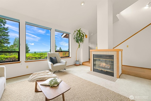 1708 Whatcom St, Bellingham, WA 98229 - living room featuring carpet floors, a tiled fireplace, and recessed lighting
