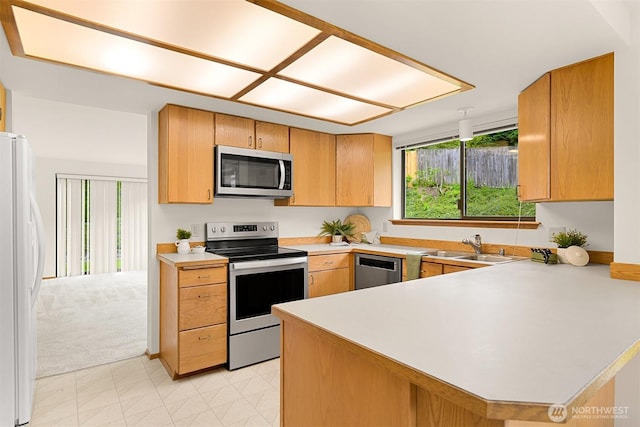 1708 Whatcom St, Bellingham, WA 98229 - kitchen with stainless steel appliances, light countertops, and a peninsula