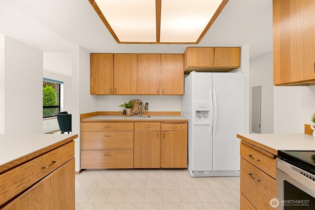 1708 Whatcom St, Bellingham, WA 98229 - kitchen featuring white refrigerator with ice dispenser, light countertops, and electric range