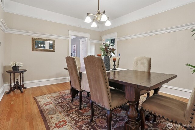 4117 44th Ave SW, Seattle, WA 98116 - dining space featuring a chandelier and light wood-type flooring