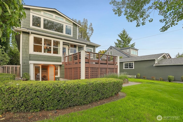 4117 44th Ave SW, Seattle, WA 98116 - rear view of house with a lawn and a deck