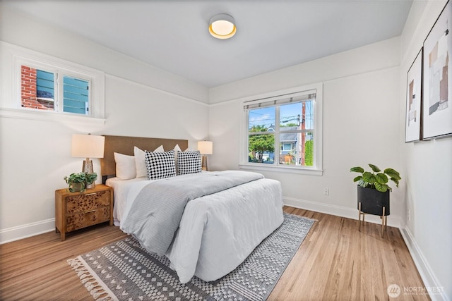 6543 12th Ave NW, Seattle, WA 98117 - bedroom featuring light wood-style floors and baseboards