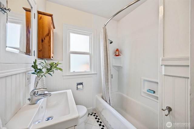 6543 12th Ave NW, Seattle, WA 98117 - bathroom featuring shower / bath combo with shower curtain and tile patterned flooring