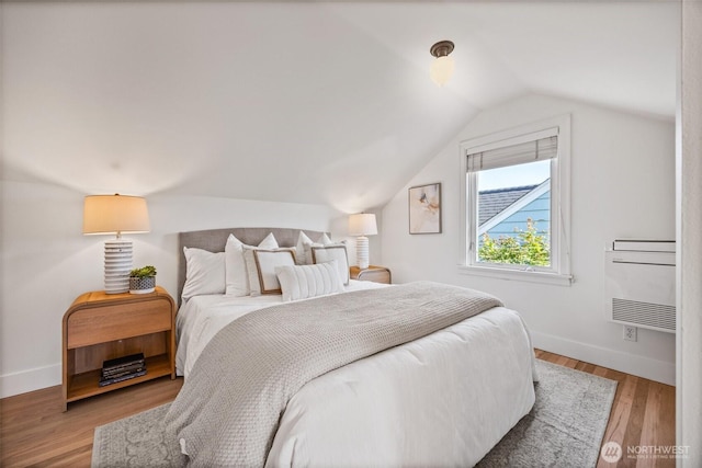 6543 12th Ave NW, Seattle, WA 98117 - bedroom featuring vaulted ceiling and wood finished floors