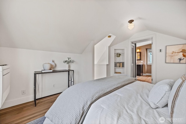 6543 12th Ave NW, Seattle, WA 98117 - bedroom featuring wood finished floors and lofted ceiling