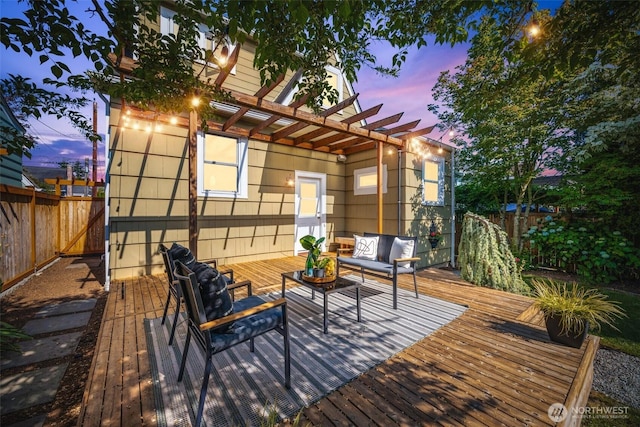 6543 12th Ave NW, Seattle, WA 98117 - wooden terrace featuring a pergola, an outdoor hangout area, and a fenced backyard