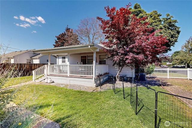 1303 Modoc, Walla Walla, WA 99362 - view of front of property featuring a fenced backyard, a garage, and a porch
