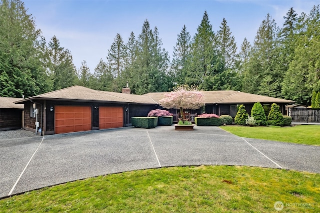 24131 SE 225th St, Maple Valley, WA 98038 - view of front of house featuring a garage, a front yard, a chimney, and driveway