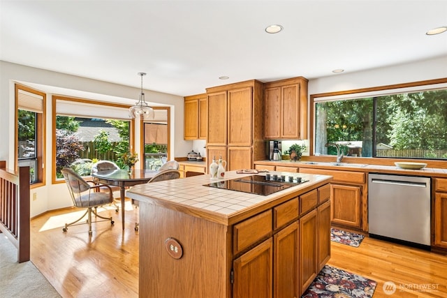 24131 SE 225th St, Maple Valley, WA 98038 - kitchen with dishwasher, tile counters, black electric stovetop, plenty of natural light, and recessed lighting