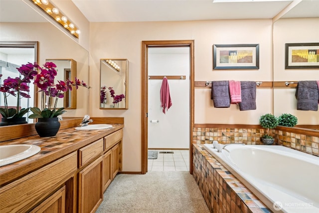 24131 SE 225th St, Maple Valley, WA 98038 - bathroom with double vanity, a garden tub, and tile patterned floors