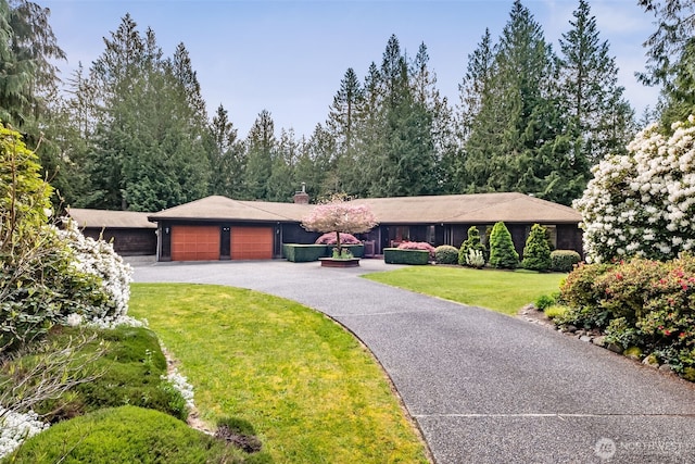 24131 SE 225th St, Maple Valley, WA 98038 - view of front facade with an attached garage, a chimney, driveway, and a front lawn