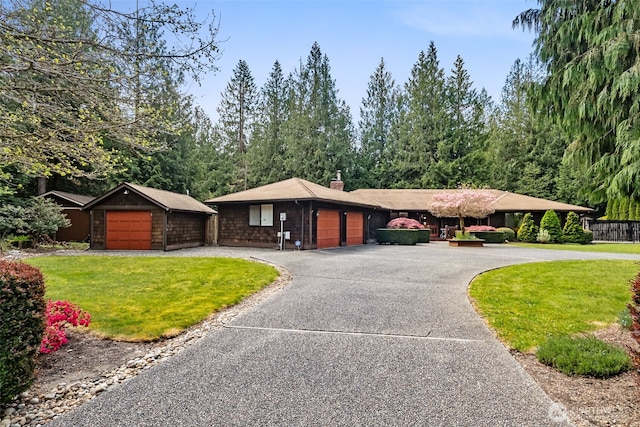 24131 SE 225th St, Maple Valley, WA 98038 - view of front of house featuring a chimney, a front lawn, a garage, and curved driveway