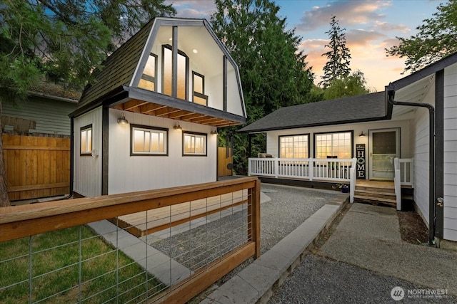 35728 157th Pl SE, Sultan, WA 98294 - view of front of home featuring a deck, a gambrel roof, and roof with shingles
