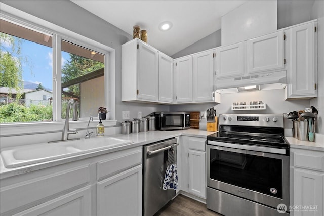 35728 157th Pl SE, Sultan, WA 98294 - kitchen with appliances with stainless steel finishes, under cabinet range hood, light countertops, lofted ceiling, and white cabinets