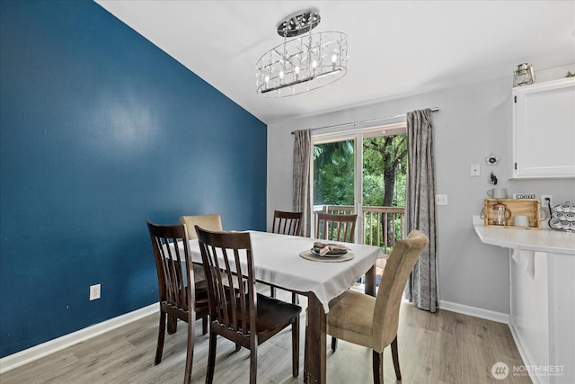 35728 157th Pl SE, Sultan, WA 98294 - dining space featuring light wood-type flooring, a chandelier, and vaulted ceiling