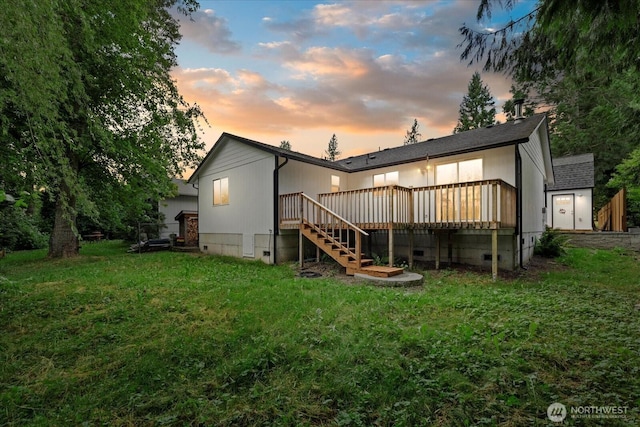35728 157th Pl SE, Sultan, WA 98294 - back of house at dusk featuring crawl space, a lawn, a wooden deck, and stairs