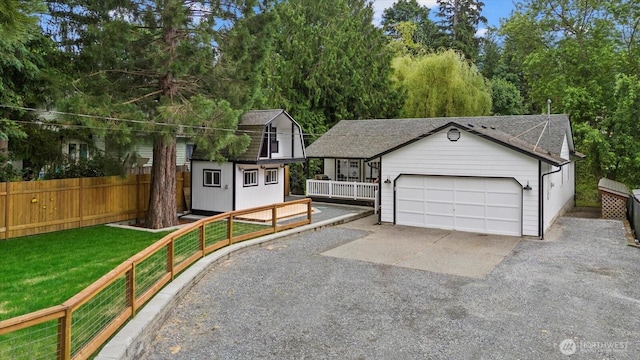 35728 157th Pl SE, Sultan, WA 98294 - view of front of home featuring an outbuilding, a garage, roof with shingles, and driveway