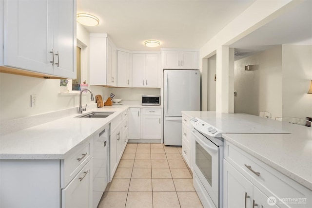 23318 3rd Pl W, Bothell, WA 98021 - kitchen with appliances with stainless steel finishes, white cabinets, light tile patterned floors, and light stone countertops