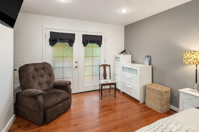 23318 3rd Pl W, Bothell, WA 98021 - living area featuring french doors, wood finished floors, and recessed lighting