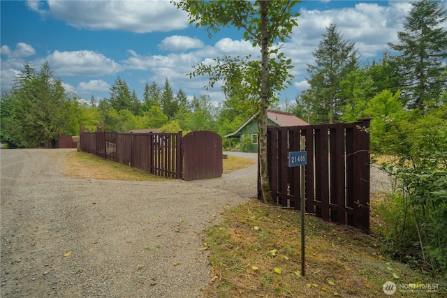 21405 Thompson Creek Rd SE, Tenino, WA 98589 - view of dirt / gravel driveway with a gate