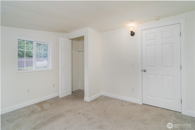 21405 Thompson Creek Rd SE, Tenino, WA 98589 - unfurnished bedroom with light colored carpet and a closet