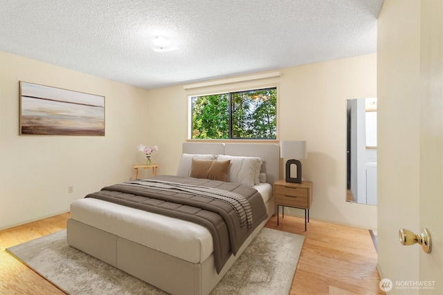 3909 Fielding Ave, Bellingham, WA 98229 - bedroom featuring wood finished floors and a textured ceiling