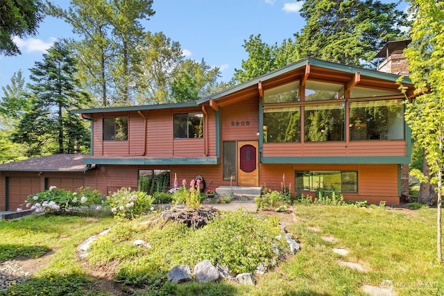 3909 Fielding Ave, Bellingham, WA 98229 - split foyer home featuring a garage, a chimney, and a front lawn