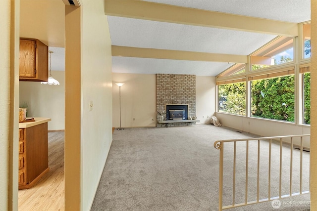 3909 Fielding Ave, Bellingham, WA 98229 - unfurnished living room featuring a brick fireplace and light carpet