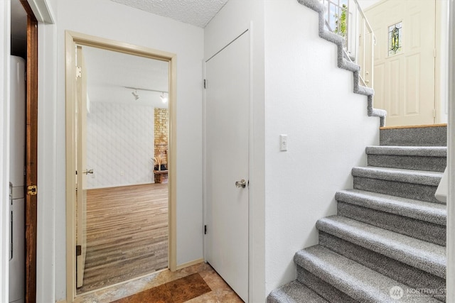3909 Fielding Ave, Bellingham, WA 98229 - stairs featuring a textured ceiling
