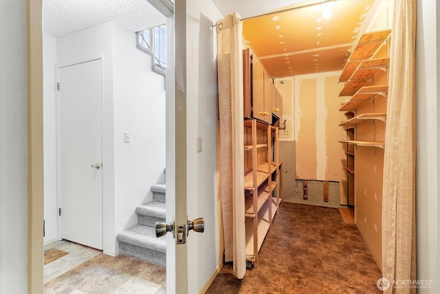 3909 Fielding Ave, Bellingham, WA 98229 - hall featuring stairs and a textured ceiling