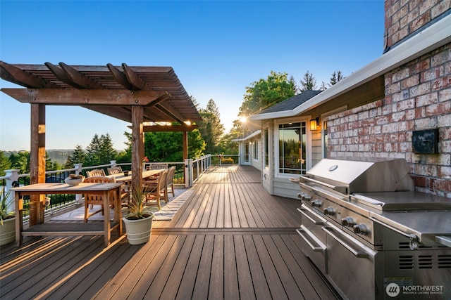 wooden deck featuring a pergola, outdoor dining area, and a grill