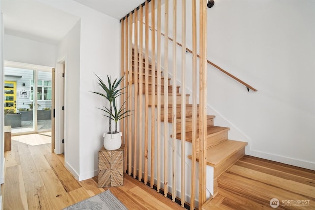 511 Howe St Unit C, Seattle, WA 98109 - stairs featuring wood finished floors and baseboards