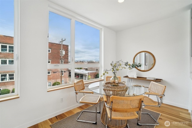 511 Howe St Unit C, Seattle, WA 98109 - dining space with baseboards and wood finished floors