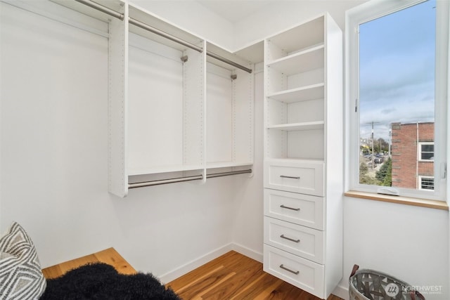 511 Howe St Unit C, Seattle, WA 98109 - walk in closet featuring wood finished floors