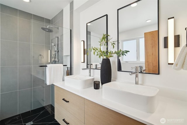 511 Howe St Unit C, Seattle, WA 98109 - full bath with a tile shower, double vanity, recessed lighting, and tile patterned floors