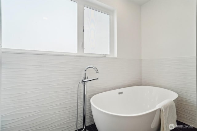 511 Howe St Unit C, Seattle, WA 98109 - full bath with a soaking tub, tile walls, and plenty of natural light
