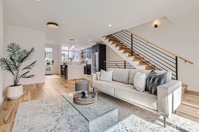 515 Howe St Unit C, Seattle, WA 98109 - living room with stairs, light wood finished floors, and recessed lighting