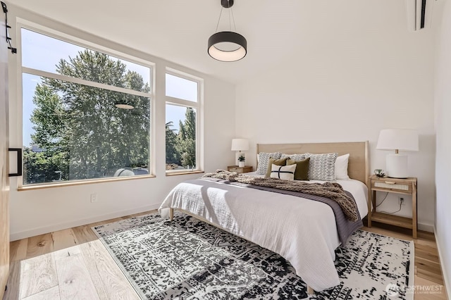 515 Howe St Unit C, Seattle, WA 98109 - bedroom featuring baseboards and wood finished floors