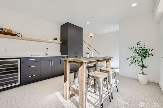 515 Howe St Unit C, Seattle, WA 98109 - indoor wet bar featuring wine cooler, light carpet, recessed lighting, and stairs