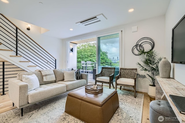 515 Howe St Unit C, Seattle, WA 98109 - living room with wood finished floors, stairway, and recessed lighting