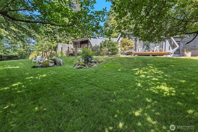 4925 Goodpiper Ln, Freeland, WA 98249 - view of green lawn featuring a deck