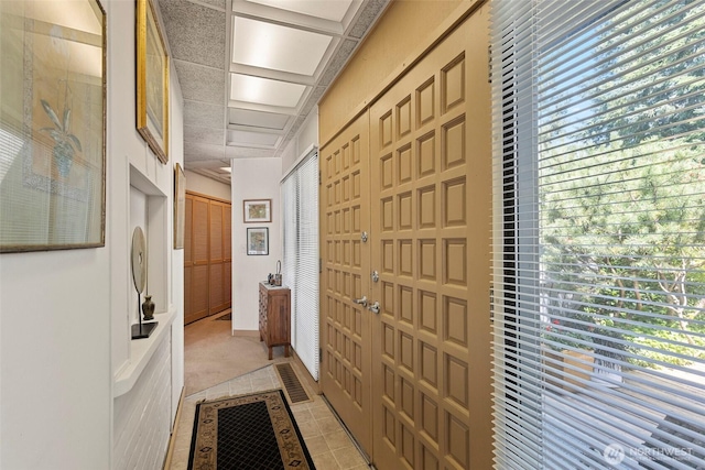 4925 Goodpiper Ln, Freeland, WA 98249 - hallway featuring plenty of natural light, light tile patterned floors, and light carpet