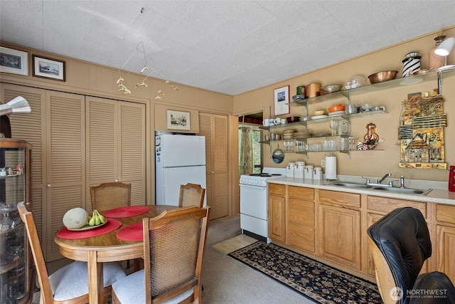 4925 Goodpiper Ln, Freeland, WA 98249 - kitchen with white appliances, light countertops, light colored carpet, and open shelves