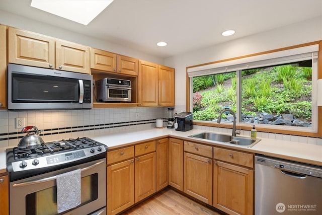 7123 NE 165th St, Kenmore, WA 98028 - kitchen featuring stainless steel appliances, light countertops, backsplash, and recessed lighting