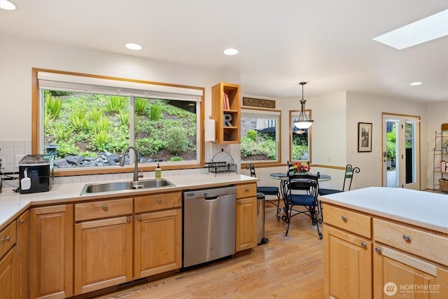 7123 NE 165th St, Kenmore, WA 98028 - kitchen featuring stainless steel dishwasher, tasteful backsplash, light countertops, light wood-style floors, and recessed lighting