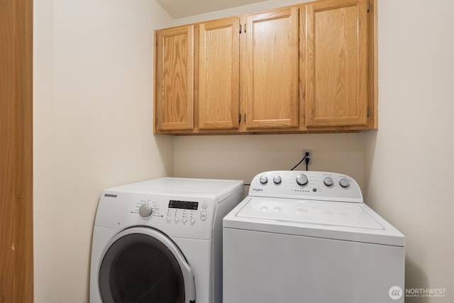 7123 NE 165th St, Kenmore, WA 98028 - laundry room featuring cabinet space and separate washer and dryer